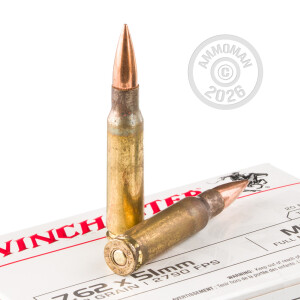 A photograph detailing the 308 / 7.62x51 ammo with FMJ-BT bullets made by Winchester.