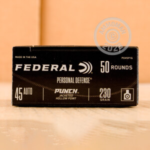 A photograph detailing the .45 Automatic ammo with JHP bullets made by Federal.