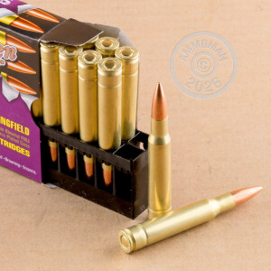 A photograph detailing the 30.06 Springfield ammo with FMJ bullets made by Golden Bear.