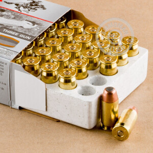 A photograph detailing the .45 Automatic ammo with FMJ bullets made by Winchester.