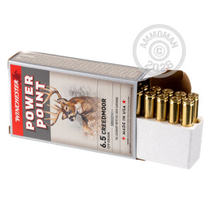 A photograph detailing the 6.5MM CREEDMOOR ammo with Power-Point (PP) bullets made by Winchester.