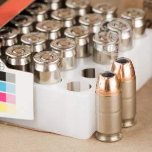 A photograph of 20 rounds of 230 grain .45 Automatic ammo with a Jacketed Hollow-Point (JHP) bullet for sale.
