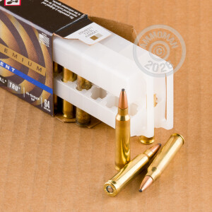A photograph of 20 rounds of 64 grain 223 Remington ammo with a soft point bullet for sale.