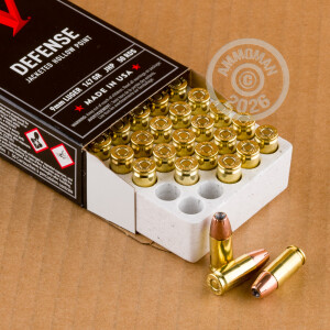 A photograph of 500 rounds of 147 grain 9mm Luger ammo with a JHP bullet for sale.