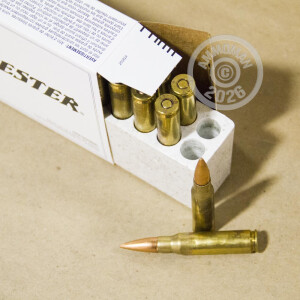 A photograph of 20 rounds of 147 grain 308 / 7.62x51 ammo with a FMJ bullet for sale.