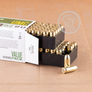 A photograph detailing the .45 Automatic ammo with FMJ bullets made by Remington.