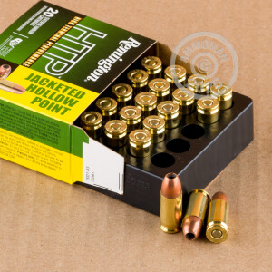 A photograph detailing the 9mm Luger ammo with JHP bullets made by Remington.