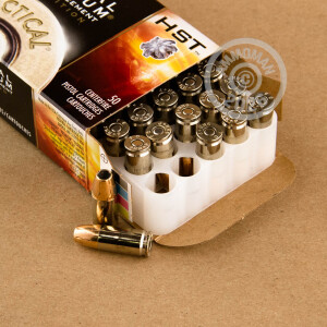 A photograph detailing the 9mm Luger ammo with Jacketed Hollow-Point (JHP) bullets made by Federal.