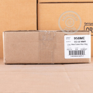 Photograph of .22 WMR ammo with JHP ideal for hunting varmint sized game, training at the range.