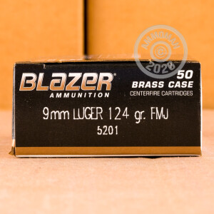 A photograph detailing the 9mm Luger ammo with FMJ bullets made by Blazer Brass.