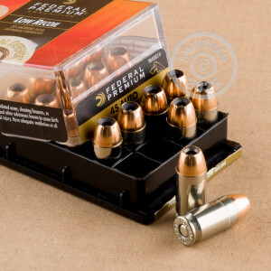 A photograph of 20 rounds of 165 grain .45 Automatic ammo with a JHP bullet for sale.