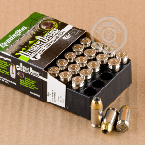 A photograph detailing the .45 Automatic ammo with JHP bullets made by Remington.