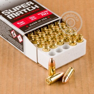 A photograph of 500 rounds of 124 grain 9mm Luger ammo with a FMJ bullet for sale.