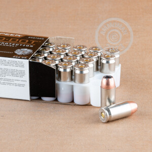 A photograph detailing the .45 Automatic ammo with JHP bullets made by Speer.