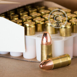 A photograph of 50 rounds of 115 grain 9mm Luger ammo with a FMJ bullet for sale.