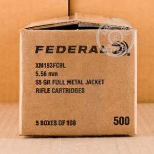 A photograph of 100 rounds of 55 grain 5.56x45mm ammo with a FMJ bullet for sale.