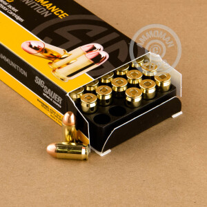 A photograph detailing the .45 Automatic ammo with FMJ bullets made by SIG.