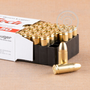 A photograph detailing the 9mm Luger ammo with FMJ bullets made by MaxxTech.