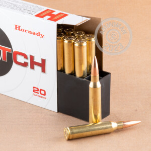 A photograph detailing the 338 Lapua Magnum ammo with Hollow-Point Boat Tail (HP-BT) bullets made by Hornady.