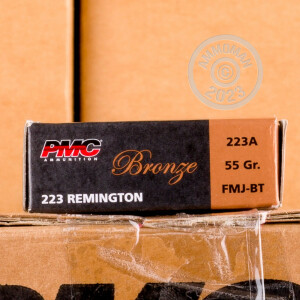 A photograph of 20 rounds of 55 grain 223 Remington ammo with a FMJ-BT bullet for sale.