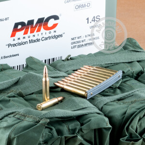Image detailing the brass case and boxer primers on 840 rounds of PMC ammunition.