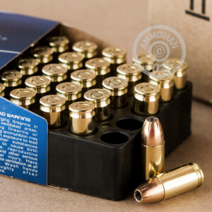 A photograph of 50 rounds of 115 grain 9mm Luger ammo with a JHP bullet for sale.