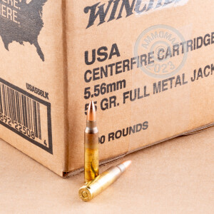 A photograph detailing the 5.56x45mm ammo with FMJ bullets made by Winchester.