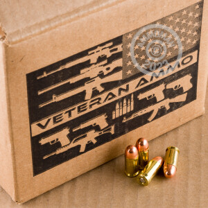 A photograph detailing the .380 Auto ammo with TMJ bullets made by Veteran Ammo.