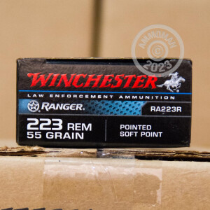 Image of 223 Remington ammo by Winchester that's ideal for home protection, hunting varmint sized game.