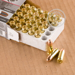 A photograph of 50 rounds of 124 grain 9mm Luger ammo with a FMJ bullet for sale.