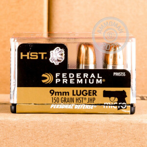 A photograph detailing the 9mm Luger ammo with JHP bullets made by Federal.