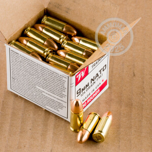 A photograph detailing the 9mm Luger ammo with FMJ bullets made by Winchester.