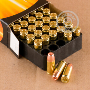 A photograph of 50 rounds of 115 grain 9mm Luger ammo with a JHP bullet for sale.