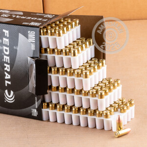 A photograph of 250 rounds of 115 grain 9mm Luger ammo with a FMJ bullet for sale.