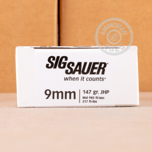 A photo of a box of SIG ammo in 9mm Luger.