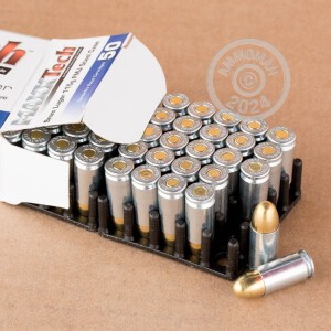 A photograph of 50 rounds of 115 grain 9mm Luger ammo with a FMJ bullet for sale.