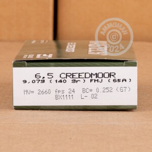 A photograph detailing the 6.5MM CREEDMOOR ammo with FMJ-BT bullets made by Magtech.