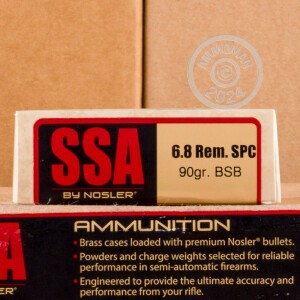 A photograph of 20 rounds of 90 grain 6.8 SPC ammo with a bonded soft point bullet for sale.