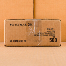 A photograph of 500 rounds of 124 grain 9mm Luger ammo with a JHP bullet for sale.