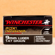 A photograph detailing the 9mm Luger ammo with JHP bullets made by Winchester.